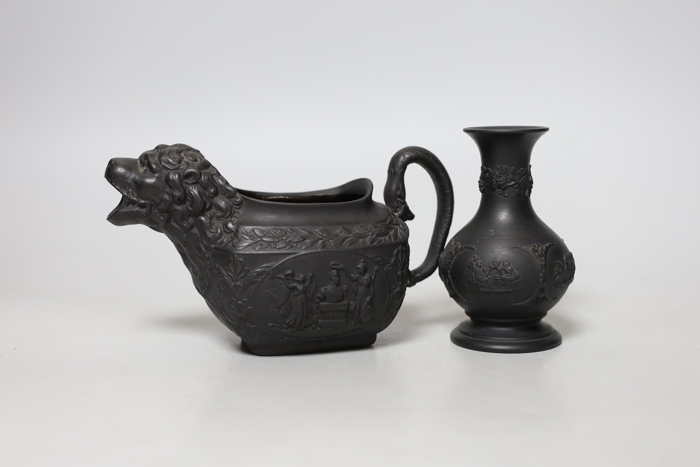 An early 19th century Wellington commemorative black basalt cream jug and a Wedgwood basalt vase